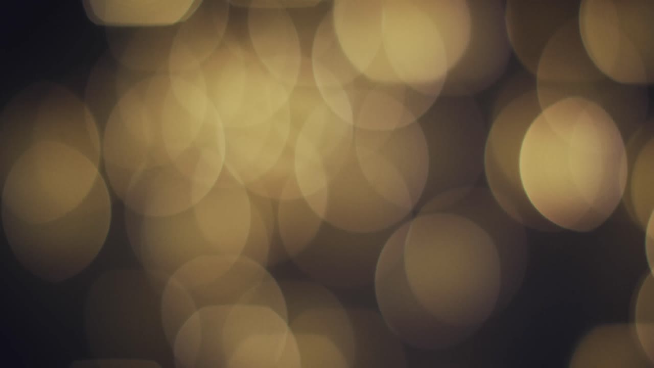 video de luces amarillas bokeh con espacio de copia en un fondo oscuro