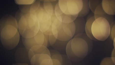 Video-Von-Bokeh-gelben-Lichtern-Mit-Kopierraum-Auf-Dunklem-Hintergrund