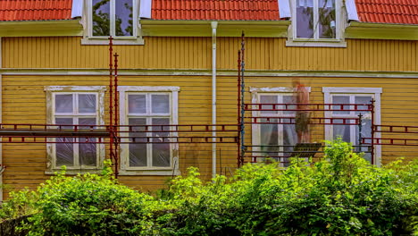 time lapse people decorating and constructing the exterior of a house