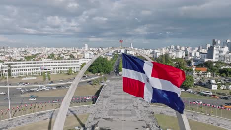 close-up of flag waving in the wind on triumphal arch, plaza de la bandera at santo domingo city