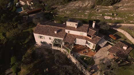 a secluded house in the south of france during the golden hour, aerial view