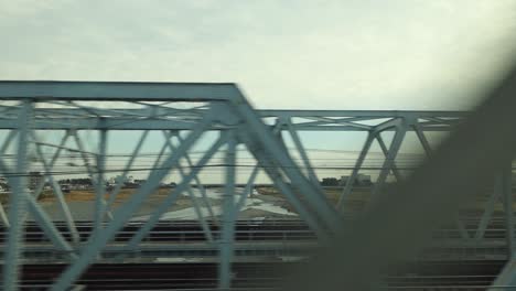 view of a bridge from a moving vehicle