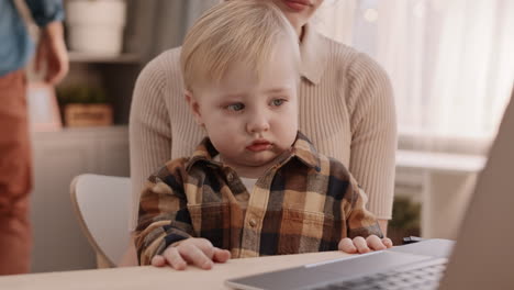 cute toddler watching laptop