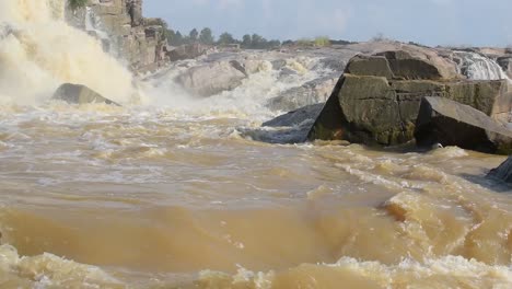 Heavy-flow-of-water-dropping-off-of-waterfalls-of-Usri-River-at-Usri-Falls-in-Giridih,-Jharkhand,-India-on-Tuesday-6th-October-2020