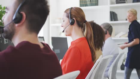 woman talking to a customer with a headphone