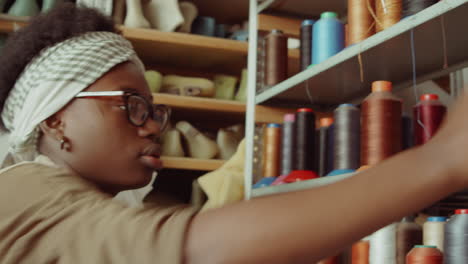 Female-Shoemakers-Choosing-Thread-in-Workshop