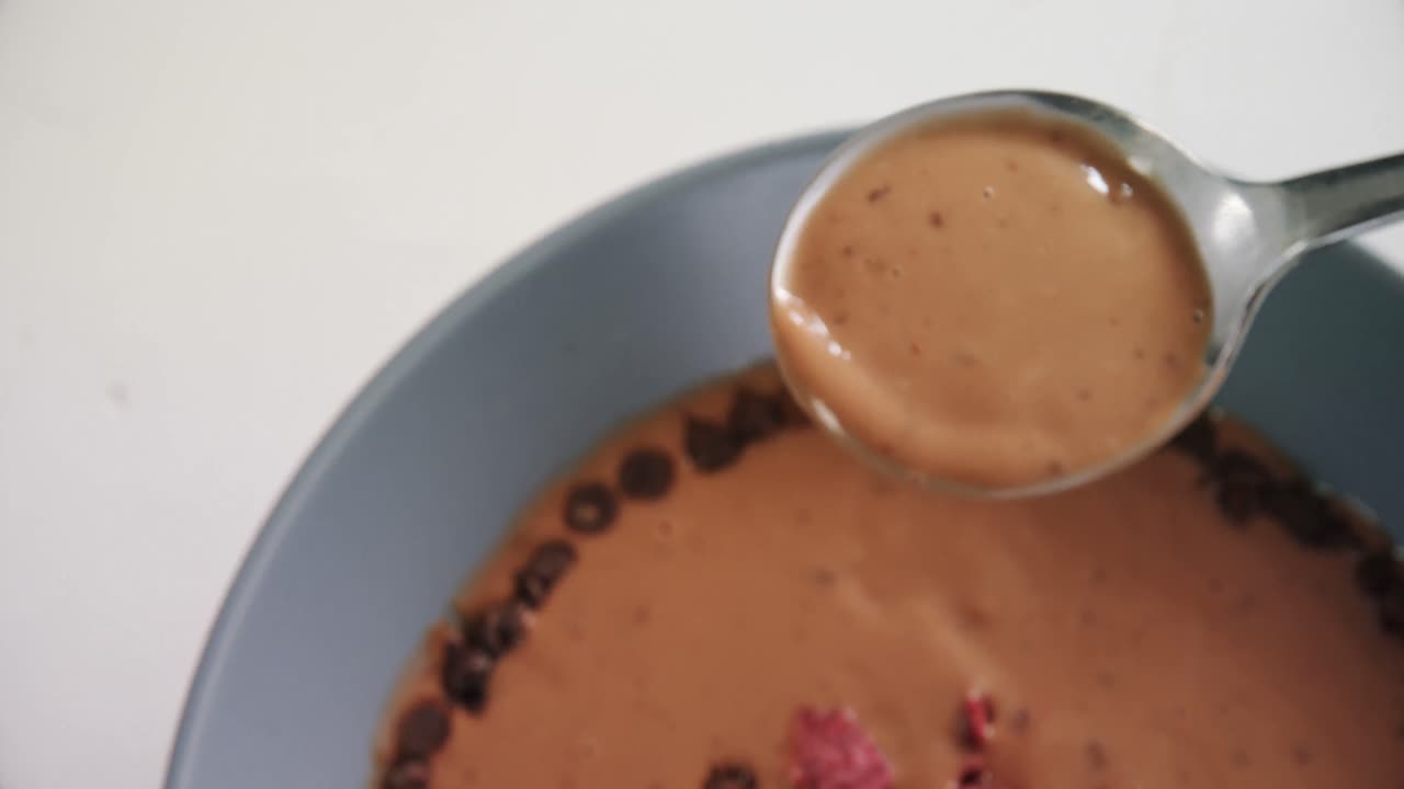 Chocolate syrup in spoon 4k