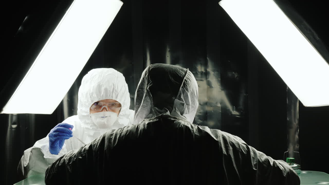 Two biologists work in the lab at their desktop