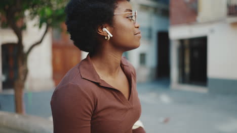 Pretty-dark-skinned-woman-resting-on-the-street