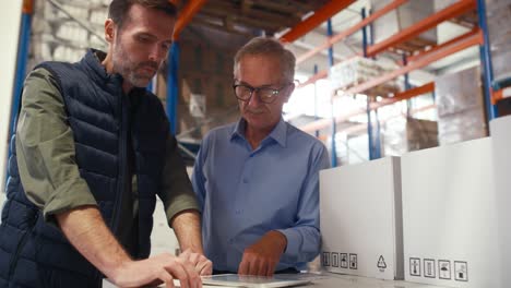 Two-caucasian-man-work-in-the-warehouse