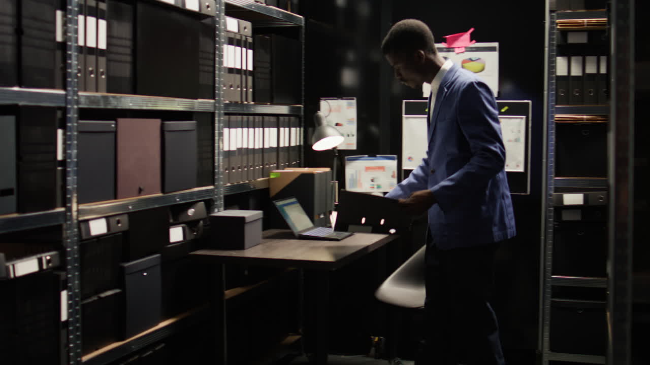 Office filing room with shelves, files, and a desk