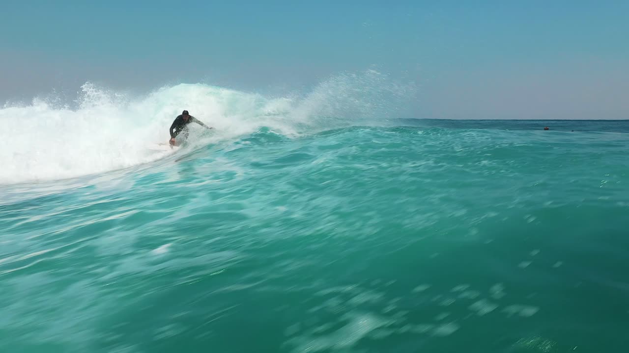 Surfing aerial on big wave in Jervis Bay