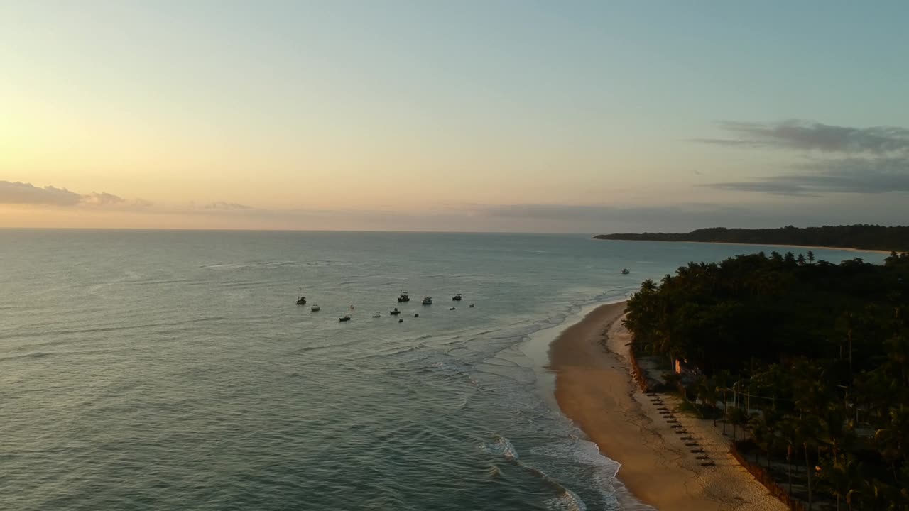 Aerial Footage over tropical Beach at sunrise