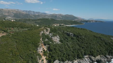 Reveal-shot-of-long-and-beautiful-Albanian-Livadi-beach