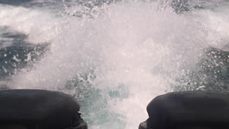 backwash of a fast motorboat on the open ocean surface