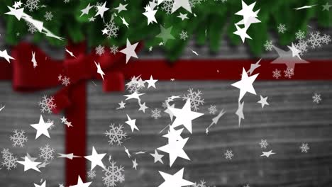 Animation-Von-Weihnachtsschneeflocken-Und-Sternen,-Die-über-Weihnachtsgeschenk-Fallen