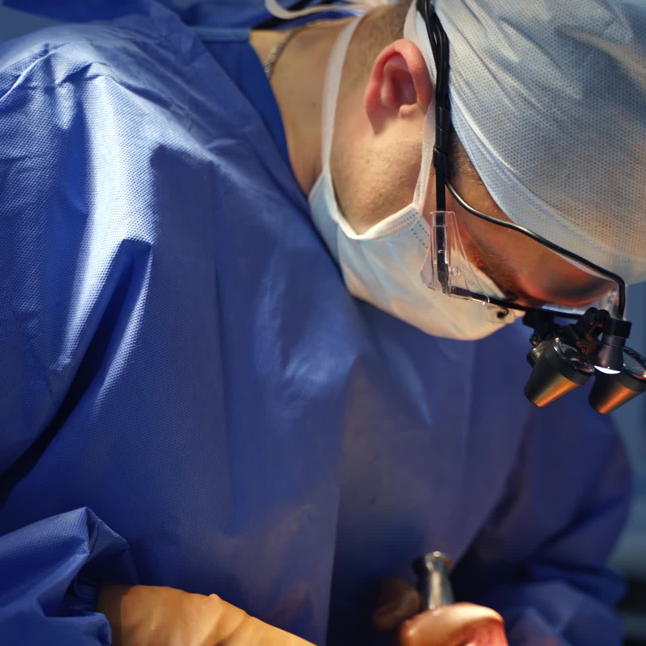 Doctor surgeonn in uniform working with patient health. Emergency surgery treatment