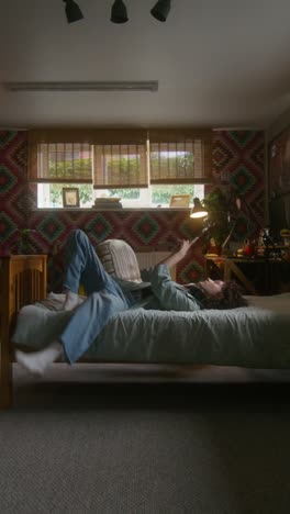 young woman relaxing in bedroom