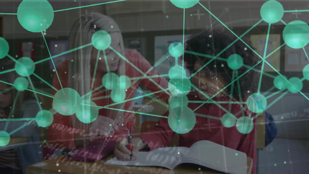 Teacher leaning, pointing, guiding student forming letters to practice while green nodes drifting