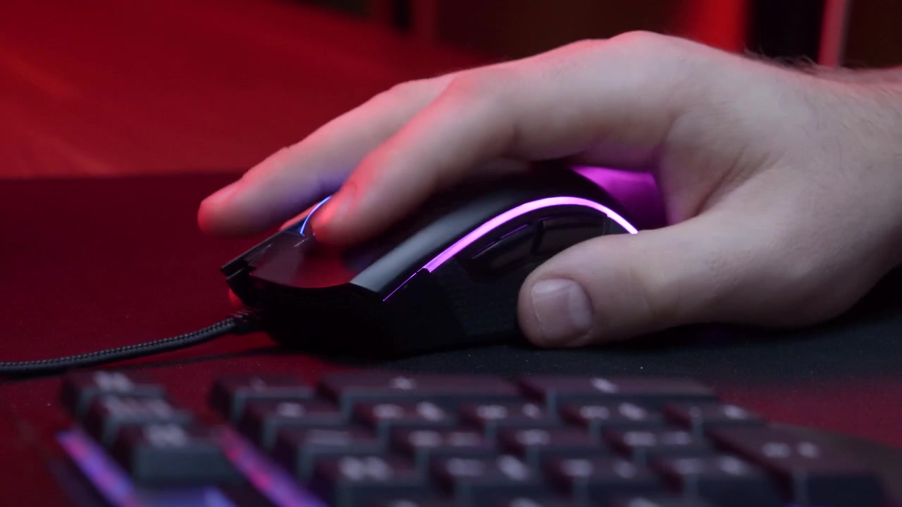 Close-up of a Hand Clicking a Gaming Mouse with RGB Lighting