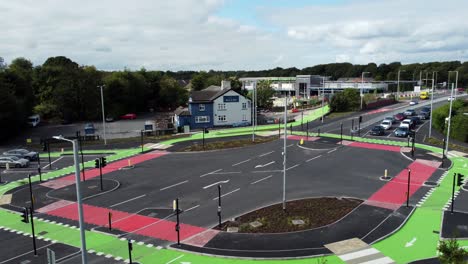 Descending-aerial-view-to-vehicles-travelling-St-Helens-CYCLOPS-traffic-optimisation-junction-crossroad-intersection