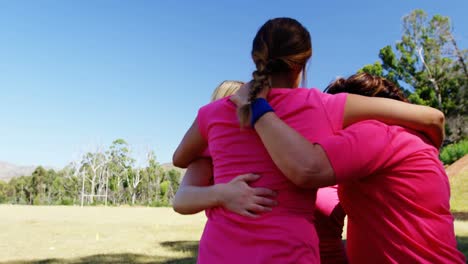 Group-of-women-forming-huddles-during-obstacle-course