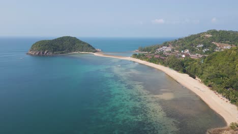 Calm-drone-flight-over-stunning-ocean-bay-with-peninsula