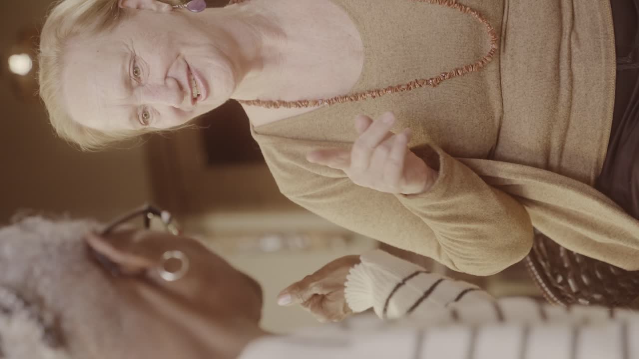 Elderly Woman Smiling and Gesturing During Conversation