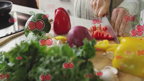 composite video of multiple cherries icons against mid section of a woman chopping vegetables