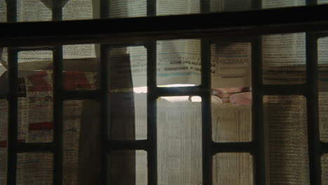 person peeking through a window
