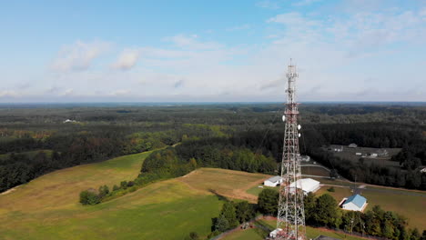 Cell-phone-tower-in-rural-country-setting-orbiting-drone