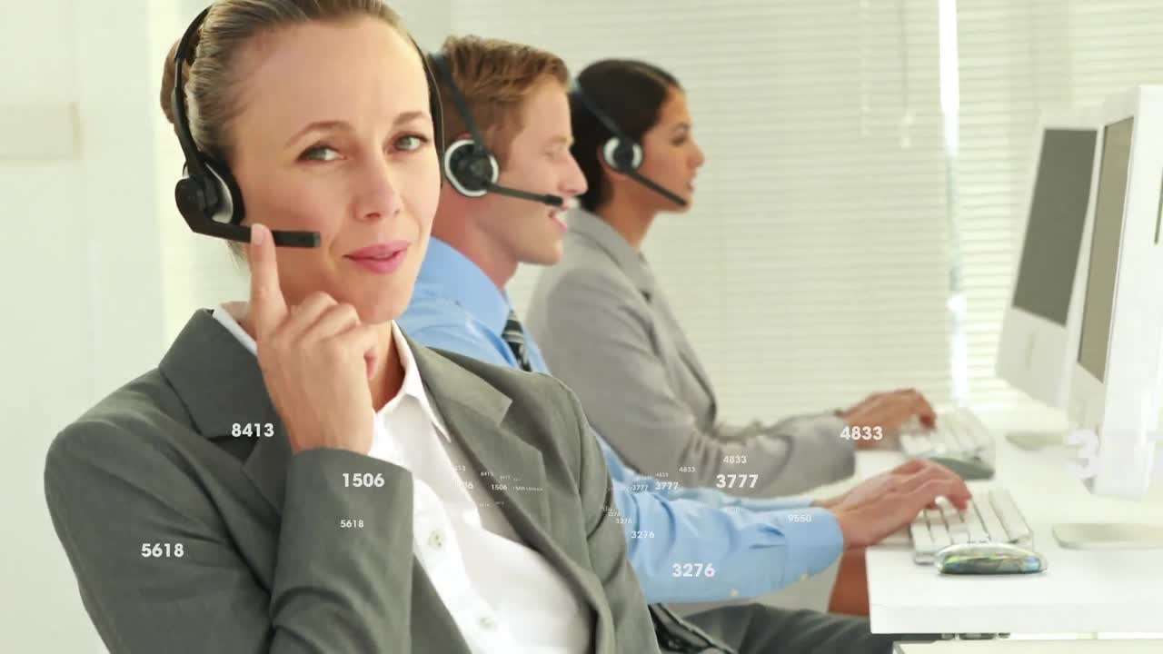 Animation of numbers changing over business people wearing phone headsets