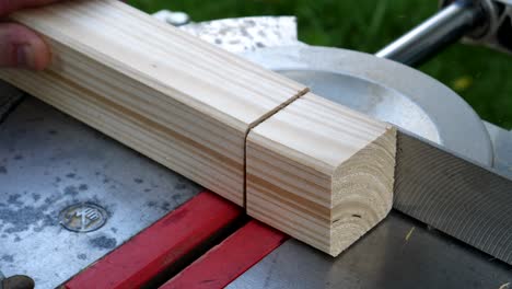 footage of a circular saw that sawing through a piece of wood