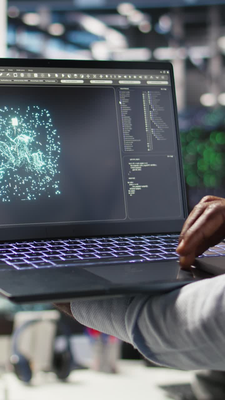 Vertical Video Close Up Of Data Center Admin Using Machine Learning Algorithms On Laptop