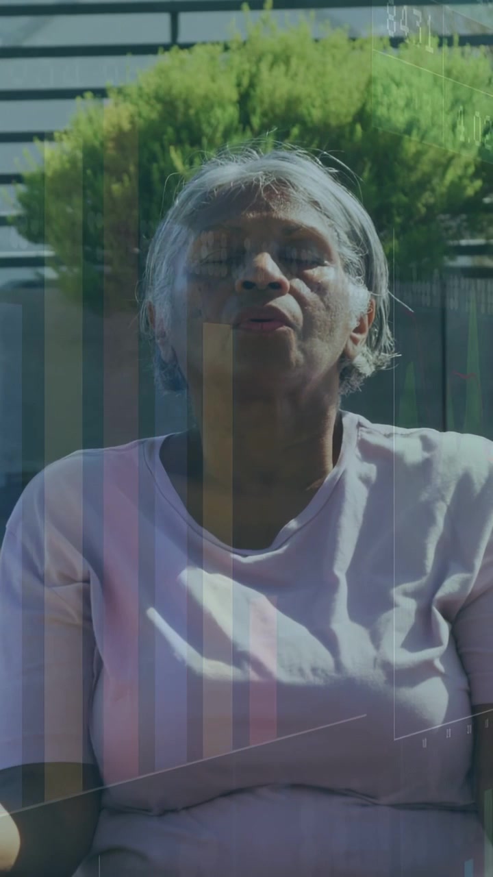 Vertical video: Senior woman sitting on bench, overlay appearing and guiding breathing for health