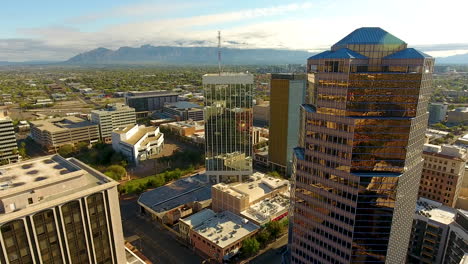 cinematic drone shot of downtown tucson arizona passing by a skyscraper