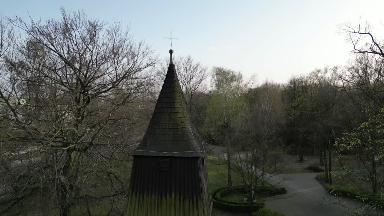 Close-up of an Old Wooden Church Tower with Moss