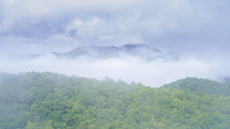 aerial drone captures the smokies melting into fog
