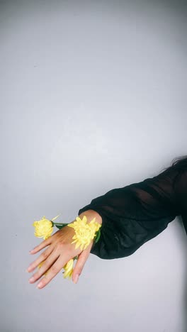 woman with yellow flowers on black sleeve