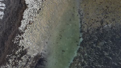 Top-Down-Shot-Of-Stunning-Rocky-Shore-On-Cactus-Beach,-South-Australia