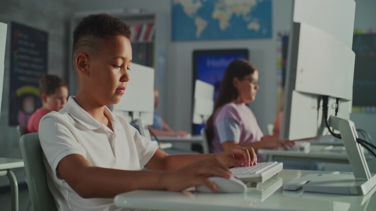 Students learning on computers in classroom