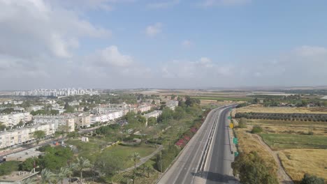 aerial shot above a traffic at netivot city, israel