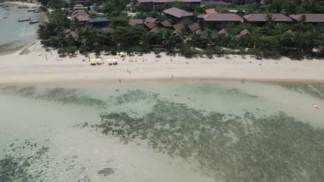 aerial view of koh pha ngan islet beach resorts, revealing turquoise sea white sand paradise