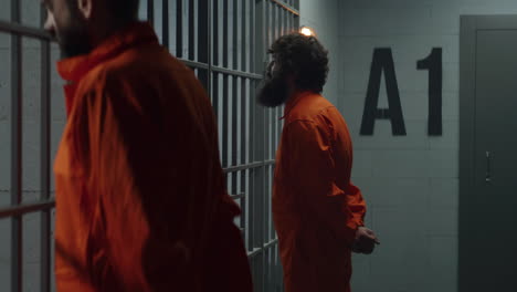 prisoners and guard in a detention cell