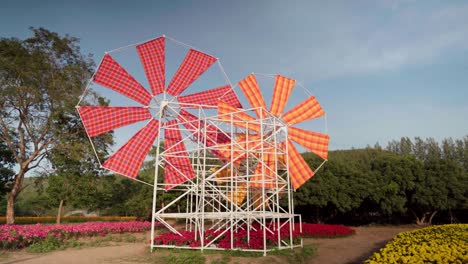 windmill art exhibit at jim thompson farm, thailand, where visitors learn about the culture of thai-laotian people and gain awareness of the ancient and beautiful northeastern culture and traditions