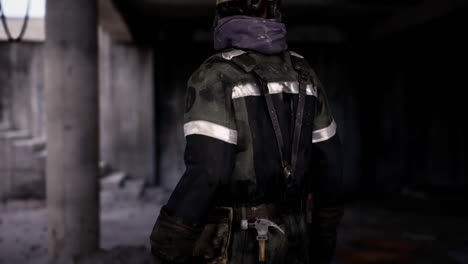 worker in protective clothing at a construction site during daytime