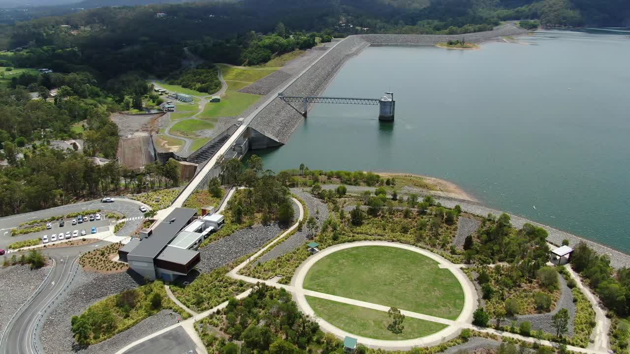 Side view of Hinze dam Gold Coast,tourist area and cafe in foreground,Calm day