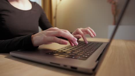 woman typing on laptop - working from home