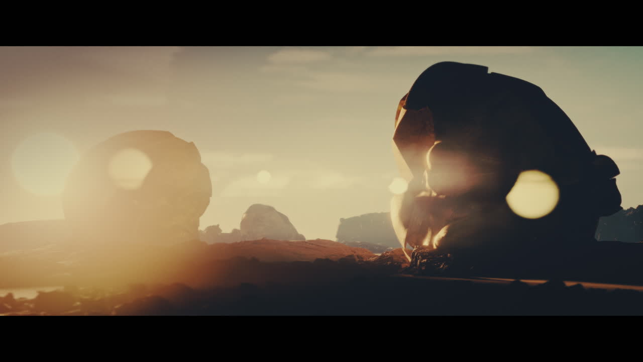 Huge golden statues in the desert during sunset