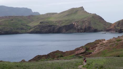 People-walk-on-scenic-hiking-trail-at-Ponta-de-Sao-Lourenco,-Madeira,-Portugal